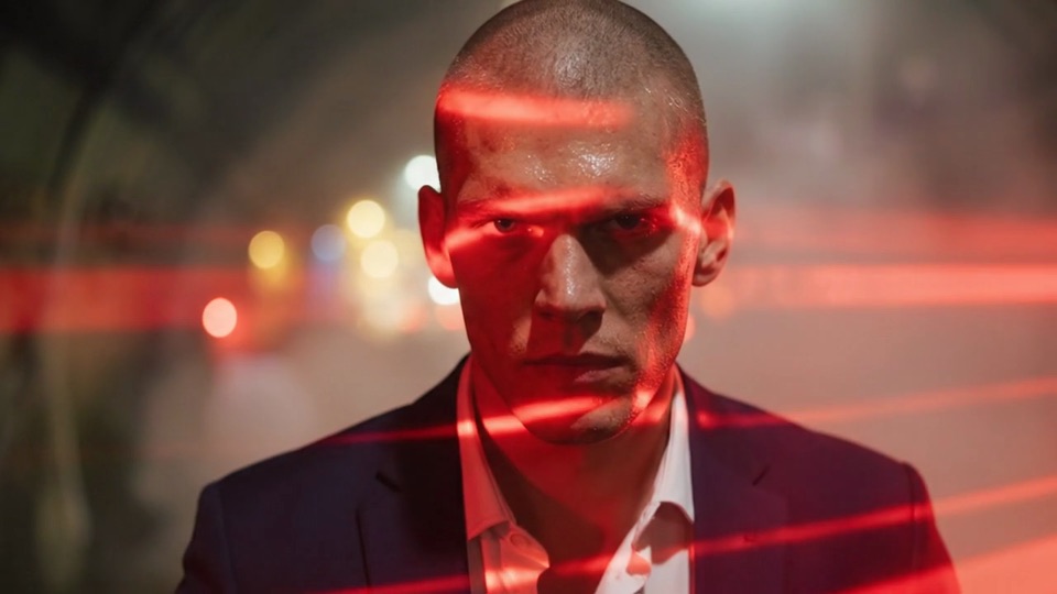 Veo 3.1 footage: a man's face with red light strips moving across it